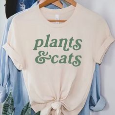 Cats and Plants shirt, Plant Shirt, Gardener t-shirt, gift for plant lover, Cat lover shirt, Retro plants shirt, Plant lady, Plant Mom Discover the purr-fect blend of your two favorite things with our Cats & Plants unisex T-shirt! This trendy and comfortable tee is a must-have for any cat lover and plant enthusiast. Made with high-quality, soft bella canvas, it features a charming graphic that creatively combines adorable cats with lush green plants. Available in a variety of sizes and popular c Plant Mom Shirt, Farmstand Recipes, Cats Plants, Gift For Plant Lover, Cat Plants, Cat Lover Shirt, Adorable Cats, Popular Colors, Plant Mom