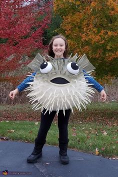 My daughter has been obsessed with Puffer fish, so we knew we would need to be creative to make her a costume this Halloween! We started with 6 layers of papier mache over an exercise ball, cut out head and arm holes, then spray painted... Puffer Fish Costume, Diy Fish Costume, Finding Nemo Costume, The Little Mermaid Musical, Nemo Costume