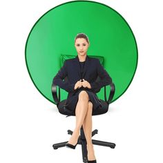 a woman sitting in an office chair with her legs crossed