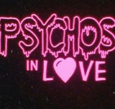 the words psychic in love are lit up against a black background with pink neon lights