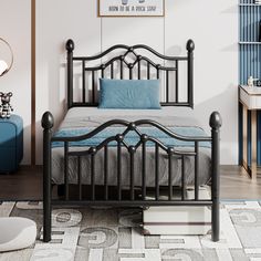 a black metal bed frame with blue pillows in a white and blue bedroom area,