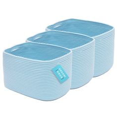 two blue storage baskets with labels on them