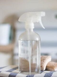 a bottle of cleaner sitting on top of a table