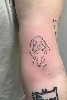 fine line tattoo of ghostface from wes craven's 1996 horror film, 'scream'. Ghostface Line Tattoo, Scream 1996 Tattoo, Ghost Face Fine Line Tattoo, Tiny Horror Movie Tattoos, Dainty Horror Tattoo, Small Horror Movie Tattoos Simple, Simple Ghost Face Tattoo, Scream Tattoo Outline, Fine Line Horror Tattoo