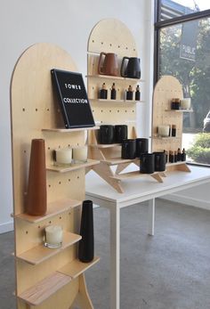 a table with some shelves and vases on it