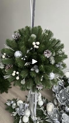 a christmas tree with silver and white decorations