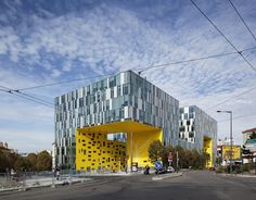 a yellow building on the corner of a street