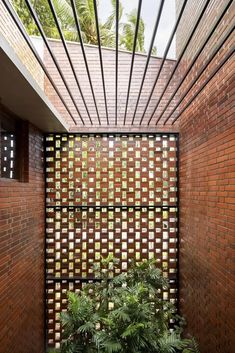 an outdoor area with brick walls and plants