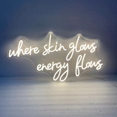 a neon sign that says, where skin glows energy flows