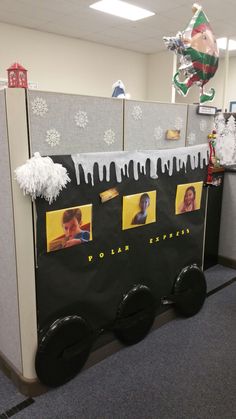 an office cubicle decorated with pictures and decorations