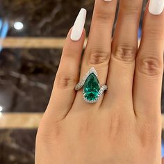 SKU#: OB875RG*Handmade to order. Please allow 3-5 business days before shipment.Primary StoneStone Type: Lab-Created GemstoneStone Cut: Pear CutStone Color: Paraiba TourmalineStone Weight: 12 CT.Stone Size: 10*15mmSide StoneStone Shape: Round CutStone Color: WhiteStone Weight: 1.0 CT.Setting InformationMetal Type: 925 Sterling SilverPlating Color: Silver Tone*Customized service of this item is available, please contact our customer service to place orders. Please notice that: the change of the s Paraiba Tourmaline Engagement Ring, Emerald Ring Design, Big Engagement Rings, Pear Wedding Ring, Tourmaline Engagement Ring, Silver Engagement Ring, Stackable Wedding Bands, Engagement Rings Affordable, Sterling Silver Wedding Band