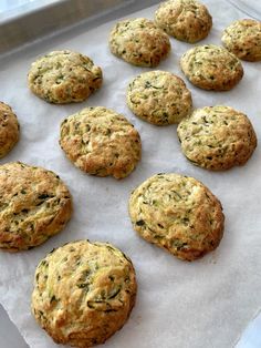 freshly baked cookies are lined up on a baking sheet