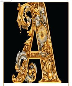 an ornate gold letter with flowers and leaves in the center on a black background,