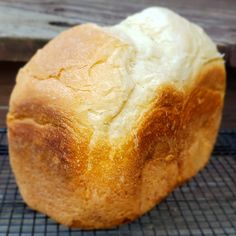 a loaf of bread sitting on top of a cooling rack