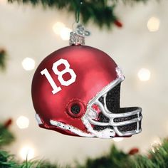 a football helmet ornament hanging from a christmas tree