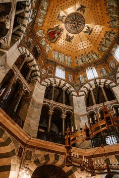 an ornate ceiling in the middle of a building