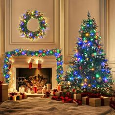 christmas tree decorated with multicolored lights and presents in front of a fire place