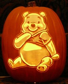 a carved pumpkin with an image of winnie the pooh on it