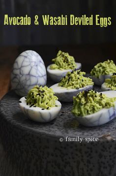 deviled eggs with avocado and wasabii deviled eggs in them