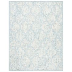 a blue and white rug with an intricate design