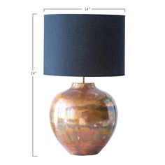 a large lamp with a blue shade on the bottom and an orange vase underneath it