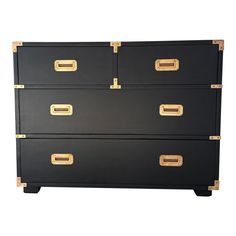 black and gold chest of drawers with brass handles on each drawer, isolated against a white background