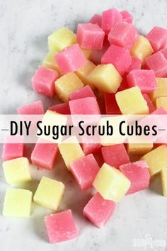 a pile of sugar scrub cubes sitting on top of a white counter with the words diy sugar scrub cubes