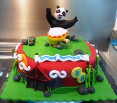 a birthday cake with a panda bear on top