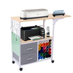 a printer and other office supplies on a cart