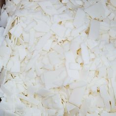 shredded white food sitting in a bowl on top of a table