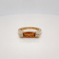 A very fine signed modernist cocktail ring.  Retailed by and marked for Asprey Co of London.  With an oval cut citrine gemstone set in center between two round brilliant pave set diamonds.  Simply a great Asprey Co. ring!  Date: 20th Century  Overall Condition: It is in overall good, as-pictured, used estate condition with some fine light surface scratches and other signs of expected light wear consistent with age.  Fineness: Marked 750 for gold fineness.  Marks: Marked to the interior for Aspre Modern Gemstone Diamond Ring For Anniversary, Modern Yellow Gold Topaz Ring With Polished Finish, Modern Gold Topaz Ring, Contemporary Oval Rings For Formal Occasions, Modern Topaz Ring With Center Stone In Yellow Gold, Modern Yellow Gold Topaz Ring With Center Stone, Modern Yellow Gold Diamond Ring With Gemstone, Modern Sapphire Ring With Diamond Accents, Yellow Gold Topaz Rings With Baguette Cut