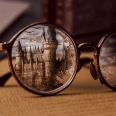 a pair of glasses with an image of a castle on them