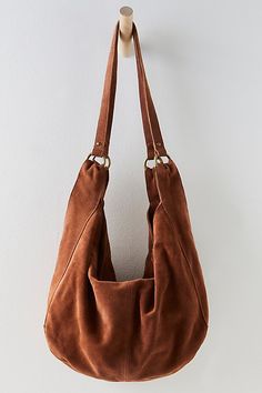 Effortlessly functional, this tote bag is featured in a slouchy hobo style with two elongated shoulder straps, all in soft suede fabrication with zipper closure for the perfect go-to bag. * Fully lined * Zipper closure * Fixed straps | Roma Suede Tote Bag by Free People in Orange Suede Tote Bag, Free People Bags, Slouch Bags, Suede Tote, Hobo Style, Womens Purses, Perfect Bag, Look At You, Women Clothing Boutique