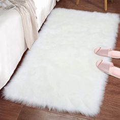 PRICES MAY VARY. Like the Real Fur: A more ethical choice for animal life, and embrace the soft, luxurious feel the same as real fur from this gorgeous faux fur rug. The Luxury of Softness: With over 3-inch plush and its natural gloss, our faux sheepskin rug is super soft and cozy to step on when you get out of bed, warming up your feet since the day begins. Premium Suede Backing: The fluffy bedroom rug 2x3 Feet with high-end suede backing, unlike other brands who use pvc or dots which will brea White Fluffy Rug, Carpet Nursery, White Faux Fur Rug, Fluffy Rugs, Faux Fur Area Rug, Mood Bored, Faux Sheepskin Rug, Girls Dorm Room, Shag Carpet