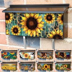 sunflowers are painted on the side of a brick wall with multiple metal hooks