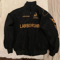 Nwot Men’s Lamborghini Jacket, Size M (Runs Closer To A Small), Never Used, Was Gifted But Fit Too Exact. Black With Yellow Gold Embroidery. Expensive Fits Men, Lamborghini Jacket, Men’s Jackets, Streetwear Fits Men, Drip Jacket, Luxury Hoodie, Oversized Outfits, Racer Jackets, Streetwear Hats