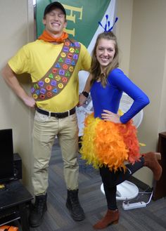 a man and woman dressed up in costumes