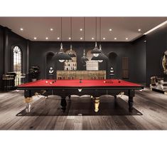 a red pool table in a room with chandeliers