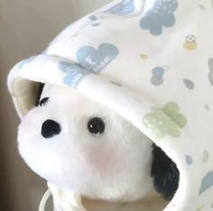 a stuffed animal is wrapped in a blanket