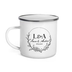 a white enamel mug with the words i & a printed on it and a silver rim