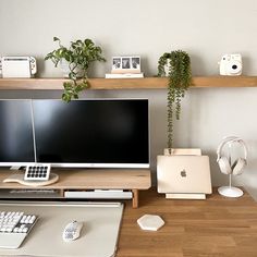 the computer desk has two monitors and a keyboard on it, along with other office supplies