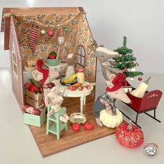 a doll house with christmas decorations and toys