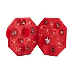 two red clocks with numbers on them sitting next to each other