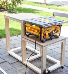 a table saw sits on top of a work bench