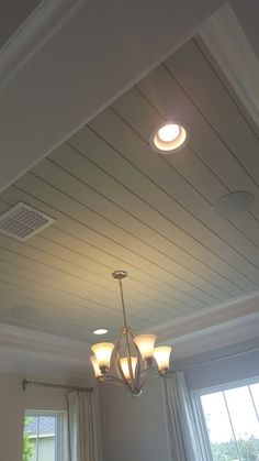 a light fixture hanging from the ceiling in a room