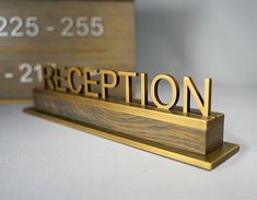 a wooden sign that says reception on it