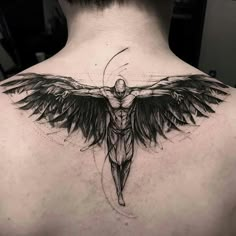 the back of a man's neck with a cross and wings tattoo on it