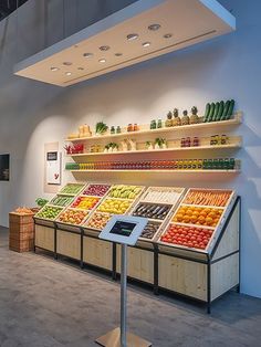 a store filled with lots of different types of fruits and veggies on shelves