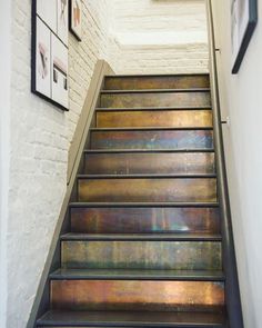 a set of metal steps leading up to a wall