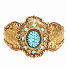 Mid-1800s Victorian handmade bangle bracelet with natural Persian Turquoise, natural patina, engraving. 37 round Turquoise in center 1.24 – 2.70mm 8 oval Turquoise 3 – 4mm Fits a standard 7 to 7 1/2 inch wrist 14k yellow gold 43.8 grams Width at top: 41.55mm Height at top: 16.63mm Width at Bottom: 14.59mm Inside dimensions: 2.21 x 1.80 inches Antique Turquoise Jewelry, Persian Jewelry, Antique Gold Bracelet, Turquoise Bangle, Handmade Bangle Bracelets, Victorian Bracelet, Antique Turquoise, Yellow Bracelet, Persian Turquoise